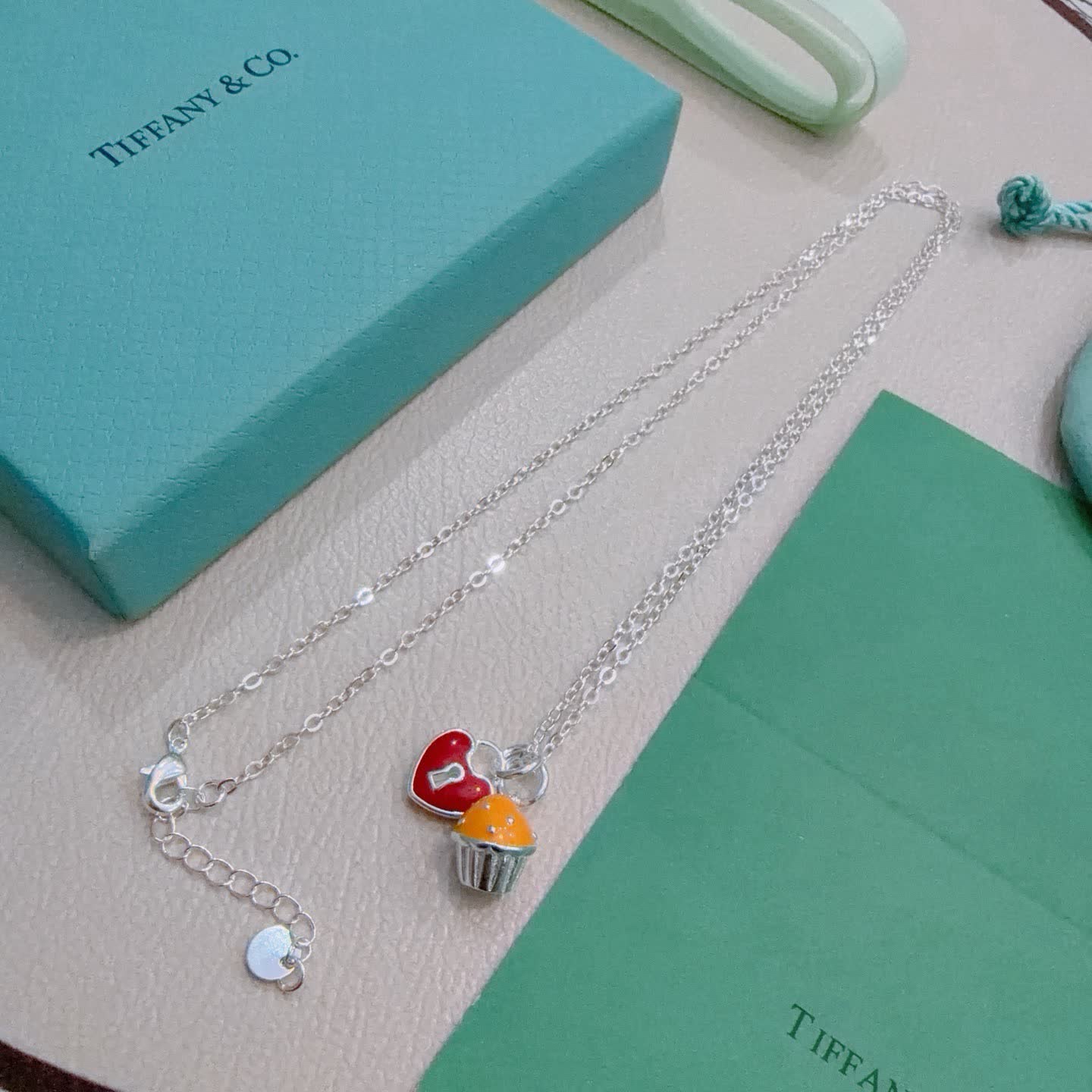Tiffany & Co. Lock and Key Necklace with Cupcake Charm